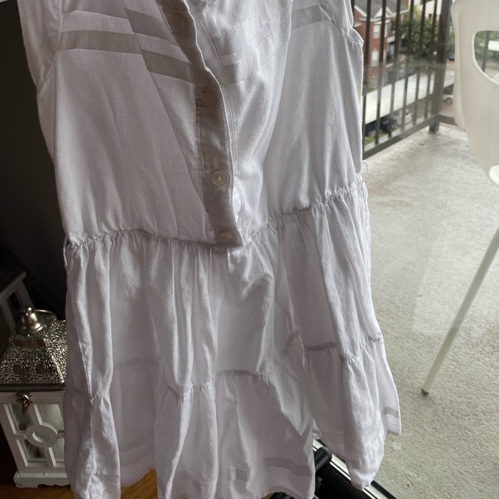 White dress the top is button up